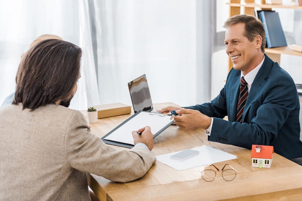 Loan officer reviewing financial repayment and debt collection options with clients.
