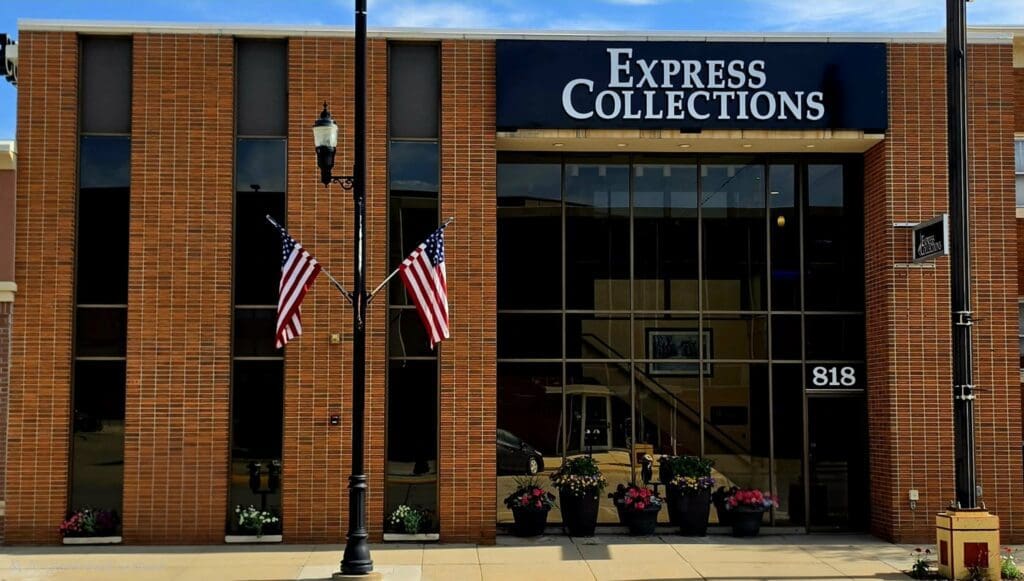 The brick exterior of the Express Collections office building at 818 Saint Joseph Street in Rapid City, South Dakota.