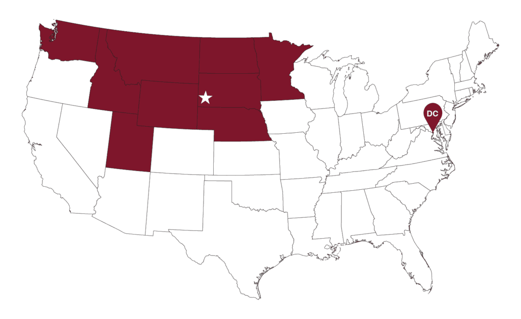 A map of the United States displaying the regional service area in maroon. Highlighted states include Washington, Idaho, Montana, North Dakota, South Dakota, Wyoming, Nebraska, Minnesota, and Iowa, with a star located over South Dakota and a pin on Washington D.C.
